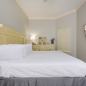 Relax on the cozy king bed in this guest suite and stream your favorite shows after a beach day