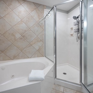 Indulge in relaxation in the master bath with a refreshing walk-in shower and soothing jetted tub