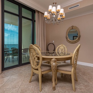 Gather around the elegant dining table and relish the cozy vibe created by warm lighting and charming decor