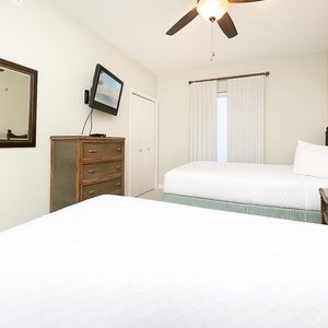 Enjoy a peaceful slumber in the queen guest suite, where plush bedding cradles you in comfort and relaxation