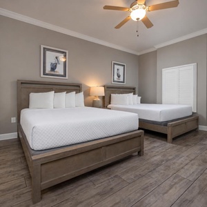 Rest in the comfort of two queen beds in this guest room, creating a cozy retreat for relaxation after beach adventures