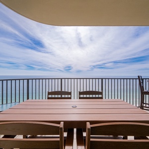 Gather around the spacious table on your balcony, sharing laughter as you take in the stunning coastal vistas