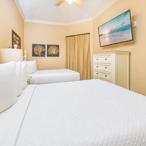 Stretch out on one of the double beds in this guest suite as you enjoy a favorite show on TV