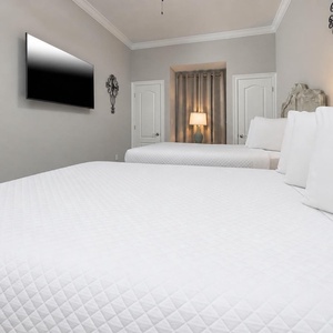 Unwind in this queen guest suite and stream your favorite shows or enjoy a good movie after a beach day