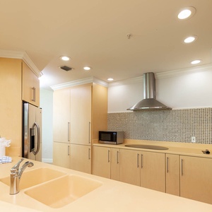 Upgrade your culinary experience in this stylish kitchen with modern stainless appliances and elegant design