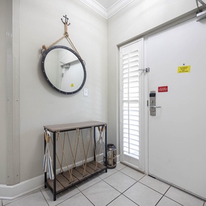 Step into this stylish entryway, where coastal decor welcomes you into this relaxing atmosphere