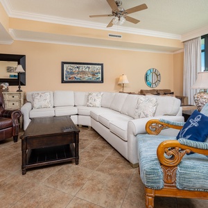 Unwind in the spacious living area, surrounded by comfy seating and serene views of the coast