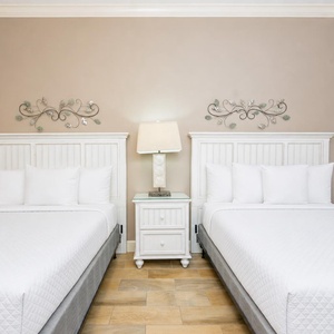 Rest in this queen guest suite, where soft linens invite you to recharge for exciting beach adventures ahead
