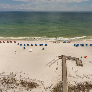 Relax on the beach, where colorful umbrellas invite you to soak up the sun and enjoy beachside fun
