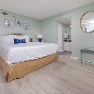 Serene master bedroom featuring a king bed, stylish decor, and convenient access to the master bathroom