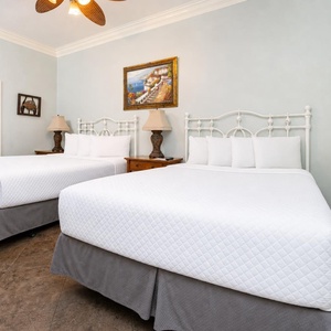 Two queen guest suite invites you to sink into peaceful rest after a day along the coast