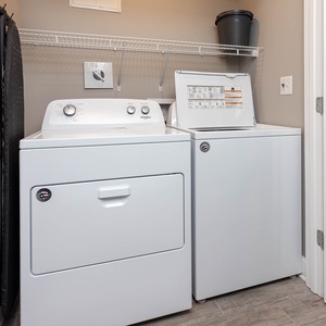 Keep your beach attire fresh in this convenient laundry space, enhancing your carefree coastal retreat