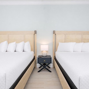 Experience peaceful nights in this queen bedroom with fluffy pillows and stylish design