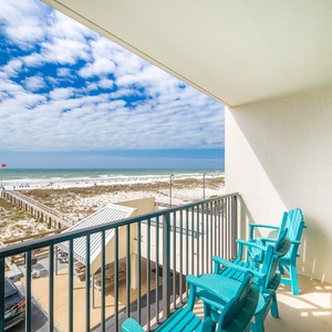 Relax in your chairs and soak in the vibrant vibes of the coast while enjoying the stunning views from your balcony
