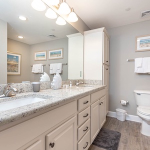 Refresh in the master bath after a day at the beach with a soothing jetted tub and relaxing walk-in shower