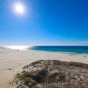 Experience breathtaking beachfront views from this inviting space, perfect for relaxation and enjoying the sun