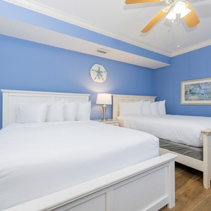 Relax on one of the cozy queen beds in this guest suite and enjoy a peaceful slumber