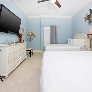Unwind in this queen guest suite and stream your favorite shows or enjoy a good movie after a beach day