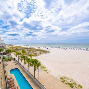 Expansive shoreline and calm waters, perfect for peaceful strolls and relaxing days by the beach