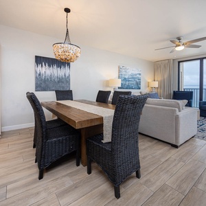 Gather around the rustic dining table, surrounded by comfortable seating and stylish decor, perfect for family meals