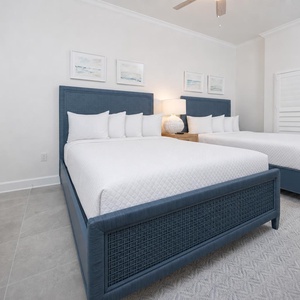 Relax on one of the cozy queen beds in this guest suite and enjoy a peaceful slumber