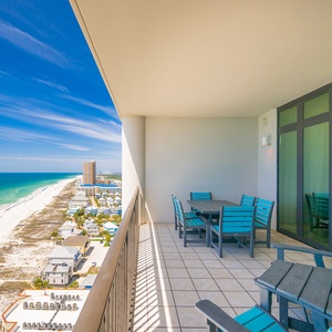 Enjoy stunning coastal views as you gather with family around your table, embracing the relaxing beach vibe on your balcony