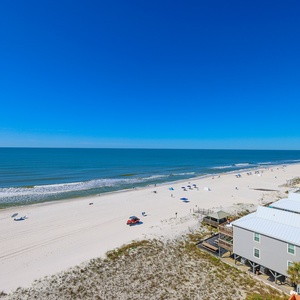 Enjoy a breathtaking beachfront view with soft white sands and gentle waves, perfect for relaxation and fun