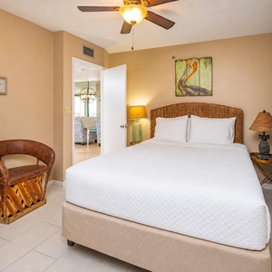 Soft tones frame your queen guest suite where restful nights await after fun beach days