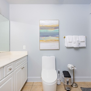 Freshen up in this guest bath in the relaxing shower or soothing tub before an exciting beach day