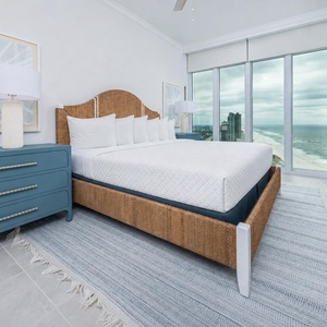 Relax on the cozy king bed in this guest suite and stream your favorite shows with stunning beach views