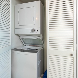 This laundry area features a convenient stacked washer and dryer, perfect for keeping your vacation clothes fresh and clean