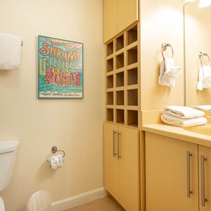 Enjoy a relaxing shower after a day of adventure in this guest bath with stylish accents and fluffy towels