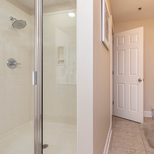 Refresh in the master bathroom featuring a walk-in glass shower, a relaxing jetted tub, and elegant fixtures for your comfort
