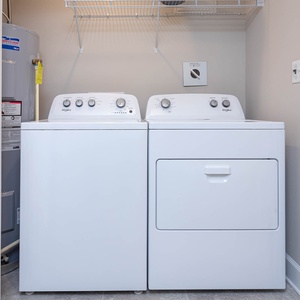 Easily freshen up your beach attire with the convenient washer and dryer, keeping you ready for coastal adventures