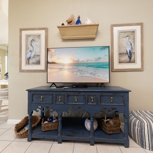 Cozy living room invites you to unwind on the sofa with a queen sleeper while streaming your favorite show