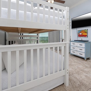 This cheerful room features a full bunk bed with full trundle, colorful sports-themed decor, and a TV, perfect for kids