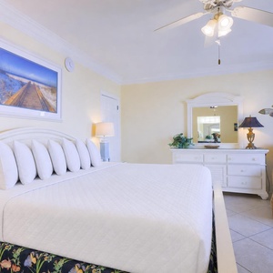 Cozy up in the master suite with a king bed and coastal accents