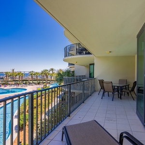 Relax on the spacious balcony, soaking in the sounds of the coast and views of the shimmering pool and lazy river area