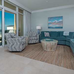 Relax on the cozy sofa with a queen sleeper in this inviting family room with breathtaking beachfront views