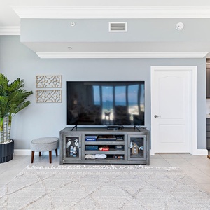 Relax in this welcoming family room with your favorite shows after a day at the beach