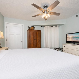 Nightlight from the ceiling fan brightens the king suite while you settle in to watch your favorite show