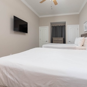 Unwind in this queen guest suite and stream your favorite shows or enjoy a good movie after a beach day