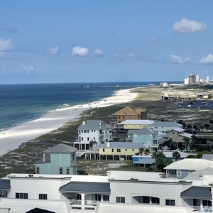 Lift your gaze across the gulf to the distant pier while feeling warm sun and a gentle coastal breeze