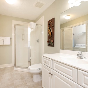 Refresh in this additional guest bath with a walk-in shower and laundry area with a washer and dryer in your rental