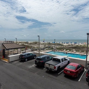 Enjoy views of the beachfront and pool area from this inviting space, perfect for relaxation and fun