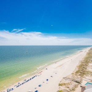 Experience seemingly endless coastline views of the horizon as waves lap the shore and the sun glistens over the water