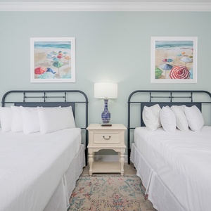 Rest in comfort on plush queen beds, with soothing decor inviting you to drift into a peaceful slumber after a beach day