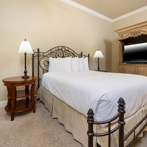 Rest in the plush queen bed in this guest suite, perfect for unwinding after a day filled with beach fun