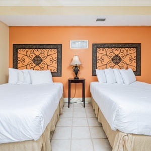 Relax on one of the cozy queen beds in this guest suite and enjoy a peaceful slumber