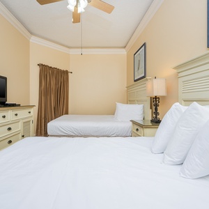 Unwind in this inviting guest bedroom, where a queen and a double bed provide a cozy retreat